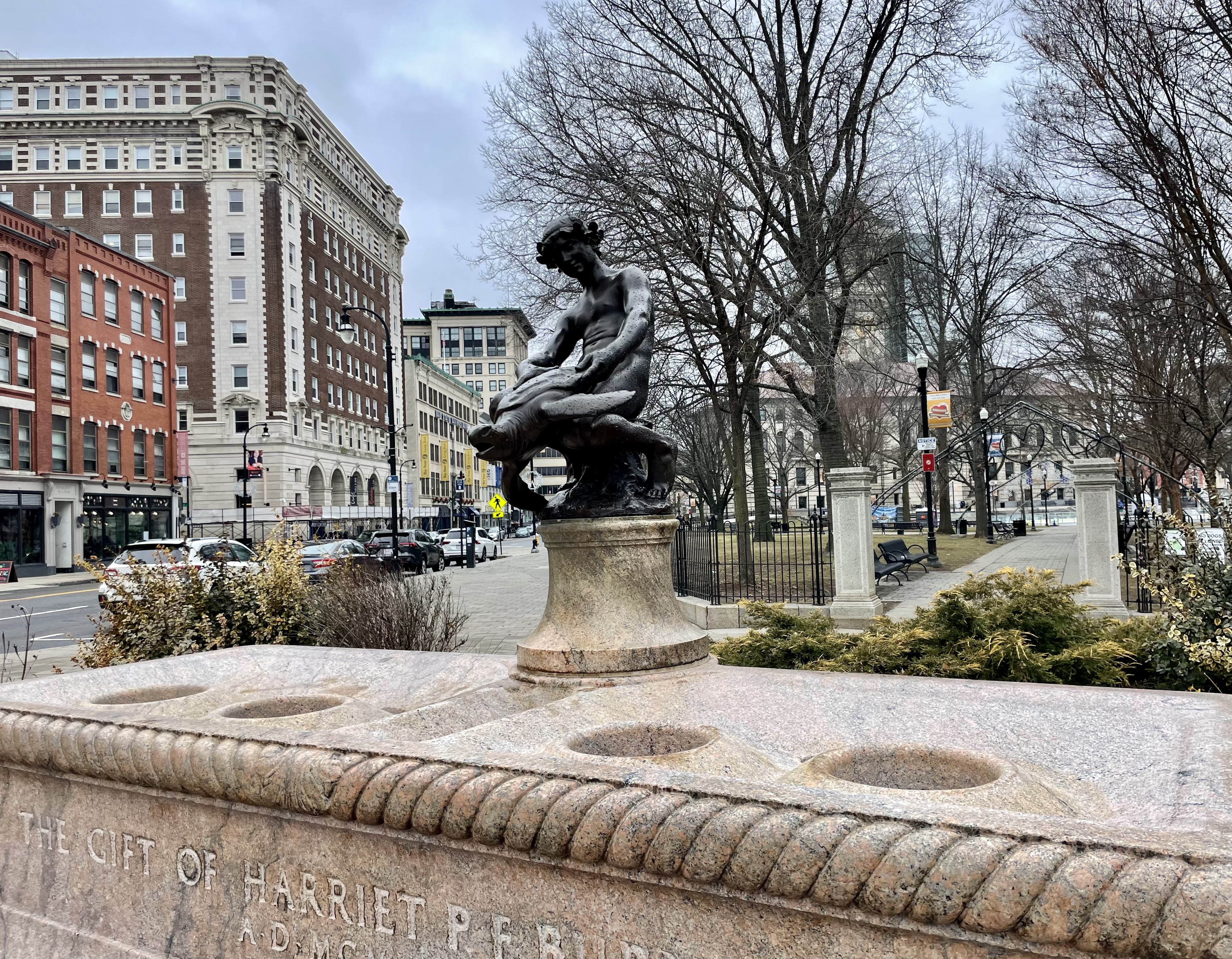 boy riding turtle statue Worcester, MA