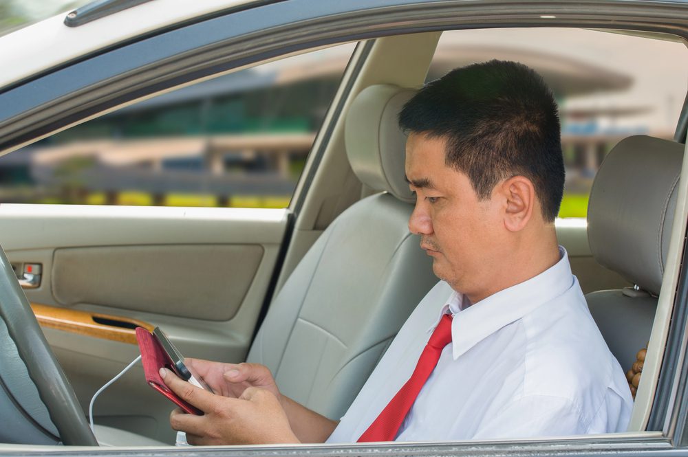 taxi driver waiting in taxi in Vietnam